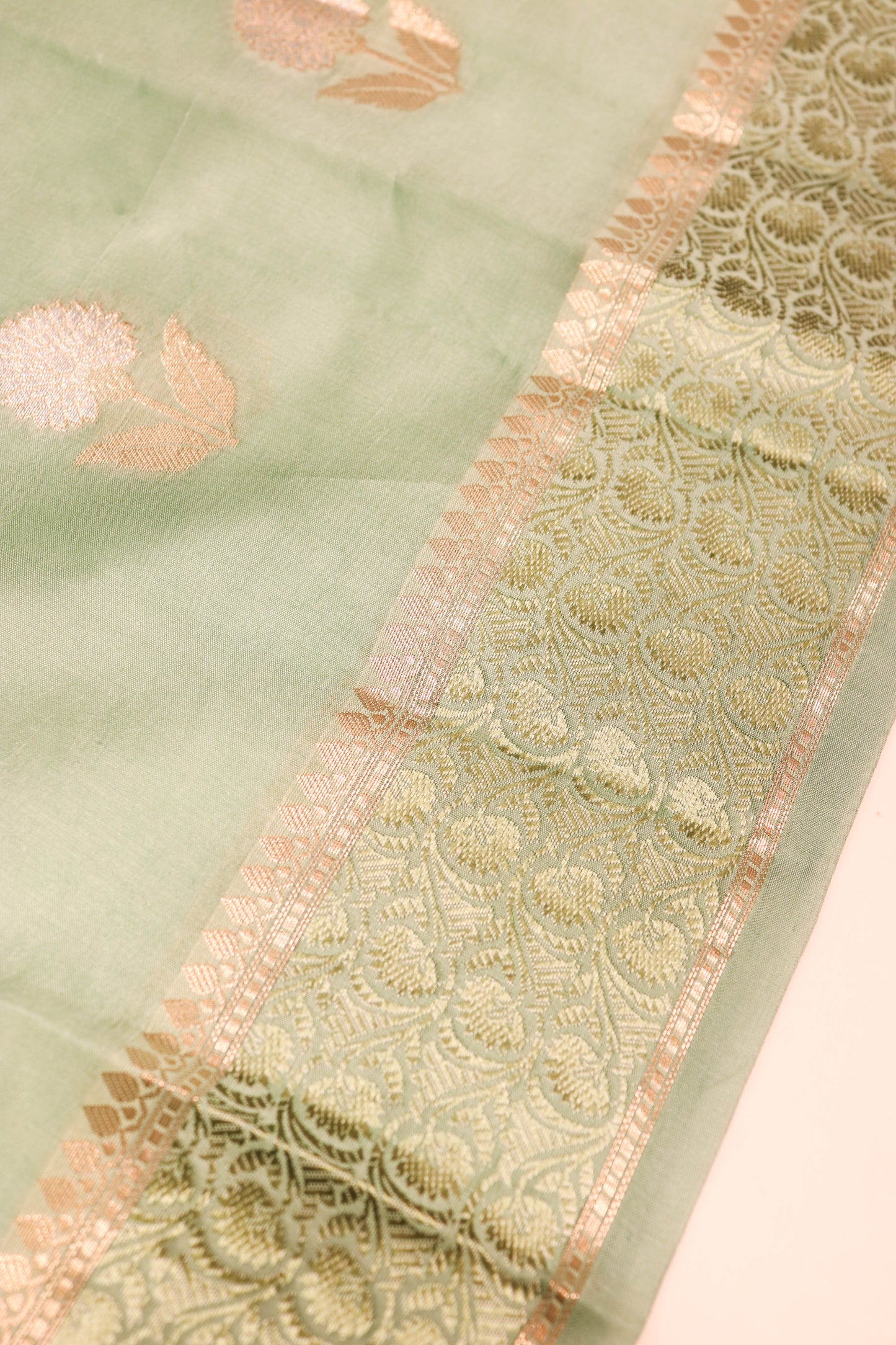 Resham Weaving Border And Silver And Gold Zari Motif In Pure Dupion Silk Green