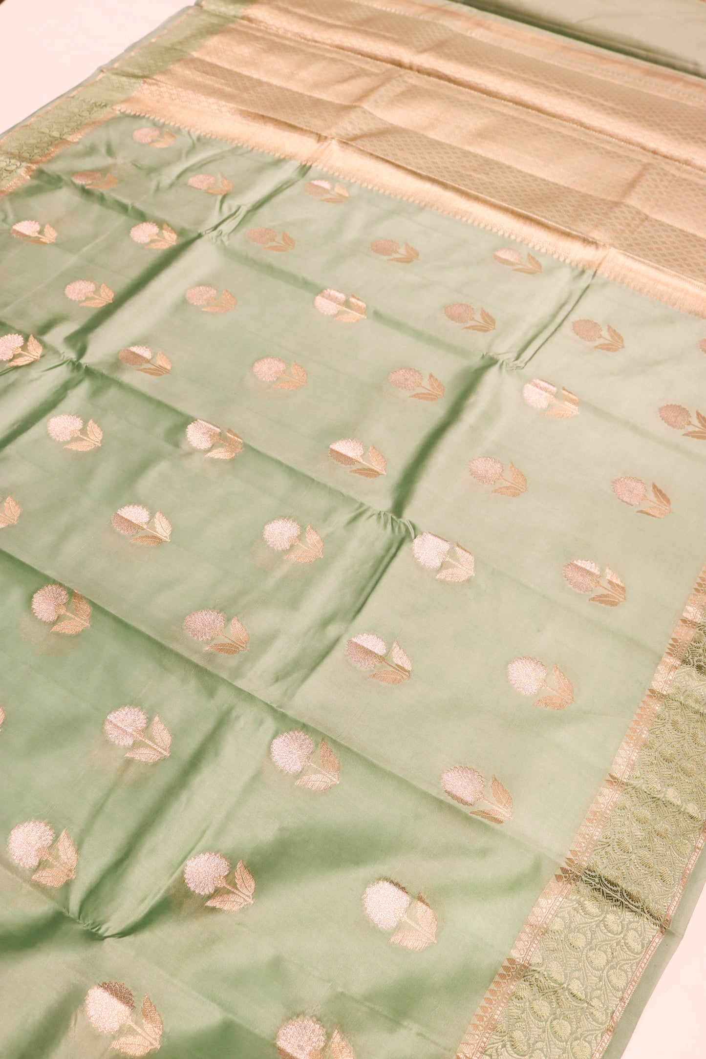Resham Weaving Border And Silver And Gold Zari Motif In Pure Dupion Silk Green